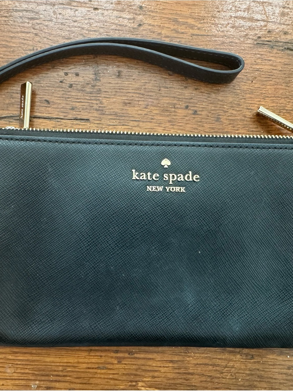 kate spade black leather wristlet with gold logo